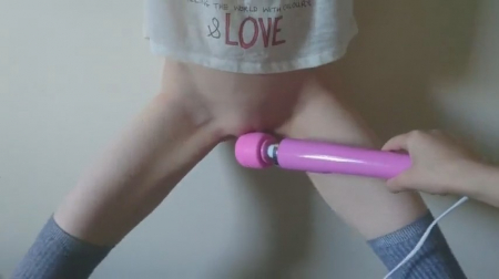 He put a vibrator to the clitoris of a girl standing against the wall porn video online   